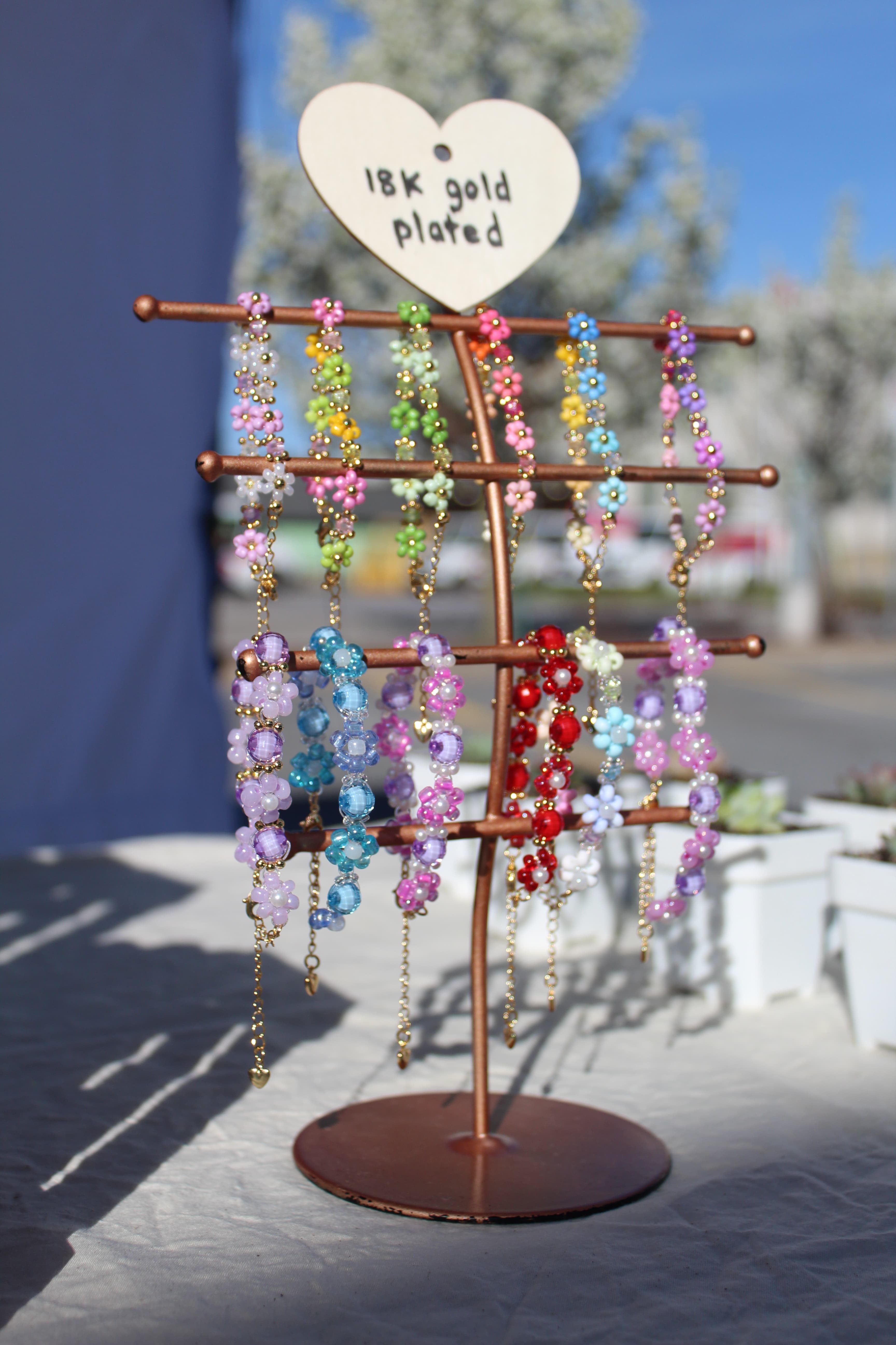 18k plated bracelets on display